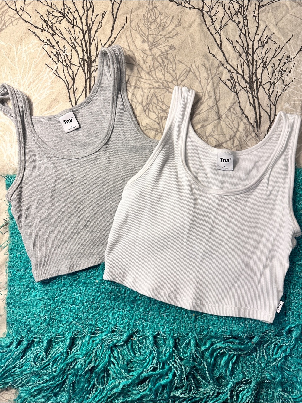 2 TNA tanks, size small